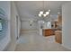 Gourmet kitchen and great room offering granite counters, an island with seating, and backyard views at 12150 Ledbury Commons Dr, Gibsonton, FL 33534