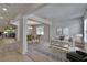 Bright living room with open floor plan, modern furnishings, and decorative area rug at 12150 Ledbury Commons Dr, Gibsonton, FL 33534