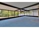 Large screened-in patio area features ceiling fans and overlooks a backyard at 12150 Ledbury Commons Dr, Gibsonton, FL 33534