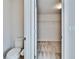 Water closet with a toilet and view to the walk-in closet at 12150 Ledbury Commons Dr, Gibsonton, FL 33534
