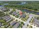 The aerial view showcases the property's proximity to a beautiful lake and lush green spaces at 12462 Rangeland Blvd, Odessa, FL 33556