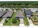 The aerial view highlights a charming home in a community near a tranquil lake at 12462 Rangeland Blvd, Odessa, FL 33556