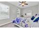 Bright bedroom offering large windows and a ceiling fan at 12462 Rangeland Blvd, Odessa, FL 33556