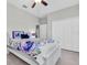 Sunny bedroom with closet and ceiling fan at 12462 Rangeland Blvd, Odessa, FL 33556
