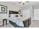Cozy bedroom boasts a ceiling fan and closet at 12462 Rangeland Blvd, Odessa, FL 33556