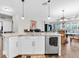 Open-concept kitchen island that flows into the living and dining areas at 12462 Rangeland Blvd, Odessa, FL 33556