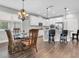 Bright kitchen features white cabinetry, granite countertops, stainless steel appliances and an adjacent dining area at 12462 Rangeland Blvd, Odessa, FL 33556