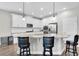 Modern kitchen with white cabinets, granite countertops, and stainless steel appliances at 12462 Rangeland Blvd, Odessa, FL 33556