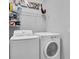 Functional laundry room with modern washer and dryer at 12462 Rangeland Blvd, Odessa, FL 33556