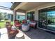 Relaxing lanai with screened enclosure and comfortable seating at 12462 Rangeland Blvd, Odessa, FL 33556