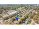 Aerial view of the neighborhood with the home highlighted by a blue arrow at 13749 80Th Ave, Seminole, FL 33776