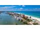 Scenic aerial view of beachside community with ocean and cityscape views at 13749 80Th Ave, Seminole, FL 33776