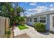 Exterior view showcasing the home's backyard, patio, and landscaping at 13749 80Th Ave, Seminole, FL 33776