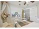 Bedroom featuring a plush bed, fan, closet and open doorway to another part of the home at 13749 80Th Ave, Seminole, FL 33776