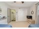 Neutral bedroom with carpet, closet, and doorway to hallway at 13749 80Th Ave, Seminole, FL 33776