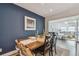 Comfortable dining area featuring a wooden table and chairs, open to the living room and kitchen at 13749 80Th Ave, Seminole, FL 33776