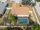 Aerial view of a home with a screened in pool, fenced yard and storage shed at 1615 Loghill Pl, Brandon, FL 33510