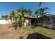 A fenced yard with mature landscaping surrounds a screened pool at 1615 Loghill Pl, Brandon, FL 33510