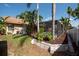 The backyard has a screened pool, mature landscaping, and a white fence at 1615 Loghill Pl, Brandon, FL 33510