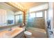 Well-lit bathroom featuring a bathtub with shower, vanity, mirror, and neutral decor at 1615 Loghill Pl, Brandon, FL 33510