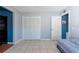 The spacious bedroom offers tile flooring, ample closet space, and neutral-colored walls at 1615 Loghill Pl, Brandon, FL 33510