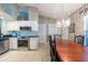 Eat-in kitchen with granite countertops, white cabinetry and modern stainless steel appliances at 1615 Loghill Pl, Brandon, FL 33510