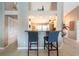 Breakfast bar with seating that connects the open floor plan to the kitchen at 1615 Loghill Pl, Brandon, FL 33510