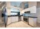 Bright kitchen featuring granite countertops, stainless steel appliances and views into the living room at 1615 Loghill Pl, Brandon, FL 33510