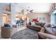 Cozy living room featuring a sectional sofa, tile flooring, and views into the kitchen at 1615 Loghill Pl, Brandon, FL 33510