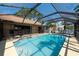 Backyard swimming pool with a screened enclosure for outdoor relaxation at 1615 Loghill Pl, Brandon, FL 33510
