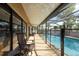 Enjoy this screened-in lanai overlooking the sparkling pool and lush landscaping at 1615 Loghill Pl, Brandon, FL 33510