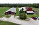 This equestrian property features barns and paddocks against a backdrop of scenic beauty at 1616 Lightfoot Rd, Wimauma, FL 33598