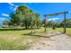 The property features a gated entrance marked by a 'Sundance Park' sign for residents only at 1616 Lightfoot Rd, Wimauma, FL 33598