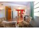 Eat-in kitchen features a modern design with checkerboard floors and vibrant red cabinetry at 1616 Lightfoot Rd, Wimauma, FL 33598