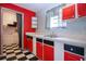 The kitchen boasts modern appliances, ample counter space, and stylish black and white accents at 1616 Lightfoot Rd, Wimauma, FL 33598