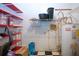 Efficient storage room featuring shelving, water heater, and plenty of storage solutions at 1616 Lightfoot Rd, Wimauma, FL 33598