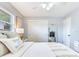 Comfortable bedroom featuring a ceiling fan, closet, full-length mirror, and side tables at 1700 25Th N St, St Petersburg, FL 33713