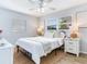 Charming bedroom with a ceiling fan, a window, and light-colored walls at 1700 25Th N St, St Petersburg, FL 33713