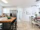 Bright eat-in kitchen featuring stainless steel appliances, island with seating and granite countertops at 1700 25Th N St, St Petersburg, FL 33713