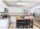 Well-equipped kitchen featuring a center island, stainless steel appliances, and white cabinetry at 1700 25Th N St, St Petersburg, FL 33713