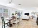 Open-concept living and dining space featuring tile flooring and light and bright walls at 1700 25Th N St, St Petersburg, FL 33713