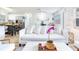 Spacious living room flowing into the kitchen and dining areas, featuring neutral decor and plenty of natural light at 1700 25Th N St, St Petersburg, FL 33713