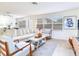 Bright living room with comfortable seating, tile flooring, and ample natural light at 1700 25Th N St, St Petersburg, FL 33713