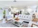 Inviting living room with bright interior, views into the dining and kitchen area, and an open floor plan at 1700 25Th N St, St Petersburg, FL 33713