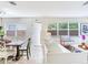 Open-concept living and dining area filled with natural light and neutral furniture at 1700 25Th N St, St Petersburg, FL 33713