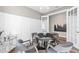 Cozy game room with a poker table, modern lighting, and neutral tones at 17085 Moonflower Dr, Venice, FL 34293