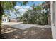 Backyard with a brick patio and a view of the blue house next door at 1913 W Pine St, Tampa, FL 33607
