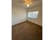 Bedroom featuring carpet, a window, and neutral walls at 2055 Sunset Point Rd # 3804, Clearwater, FL 33765