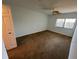 Empty bedroom featuring neutral carpet, a ceiling fan, and a window at 2055 Sunset Point Rd # 3804, Clearwater, FL 33765