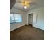 Bedroom with neutral carpet, window, and built-in storage at 2055 Sunset Point Rd # 3804, Clearwater, FL 33765